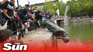 BLM protesters pull down statue of Edward Colston before throwing it into river in Bristol [upl. by Kendell]